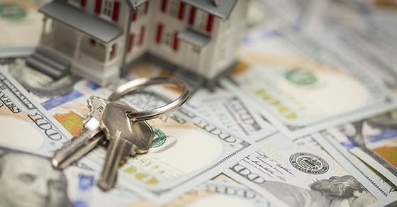 Small,Model,House,And,Keys,On,Newly,Designed,U.s.,One Small Model House and Keys on Newly Designed U.S. One Hundred Dollar Bills.