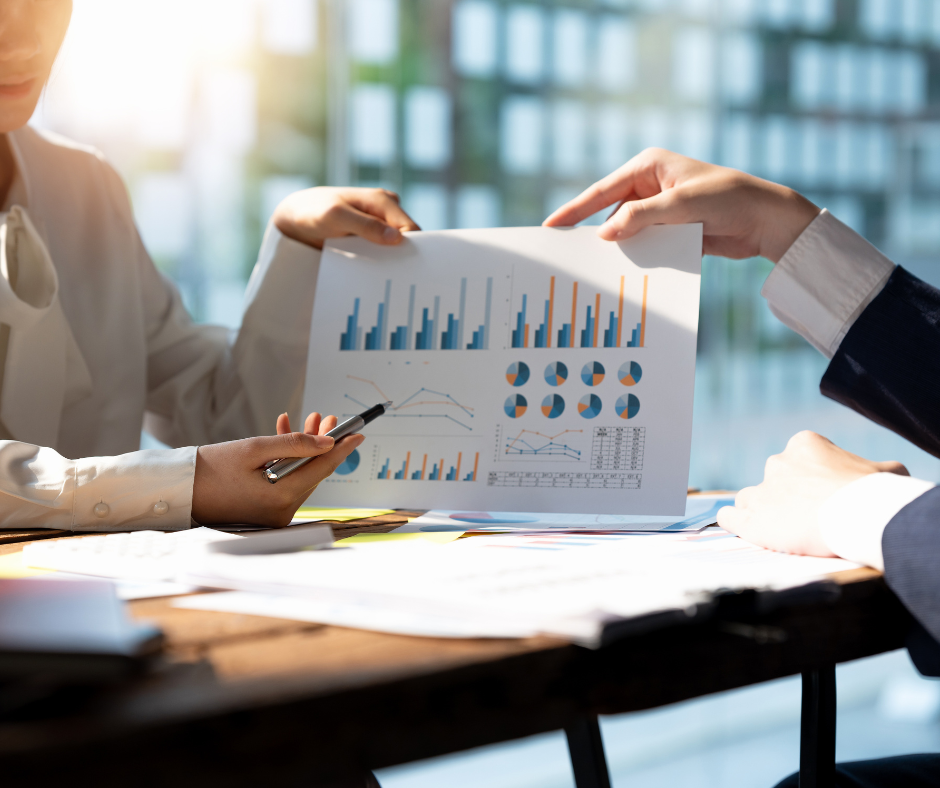 woman showing investment analysis to client woman showing investment analysis to client