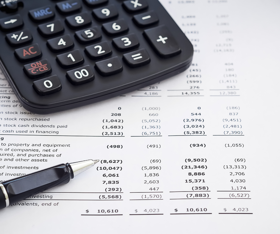 Accounting balance sheet, calculator and pen