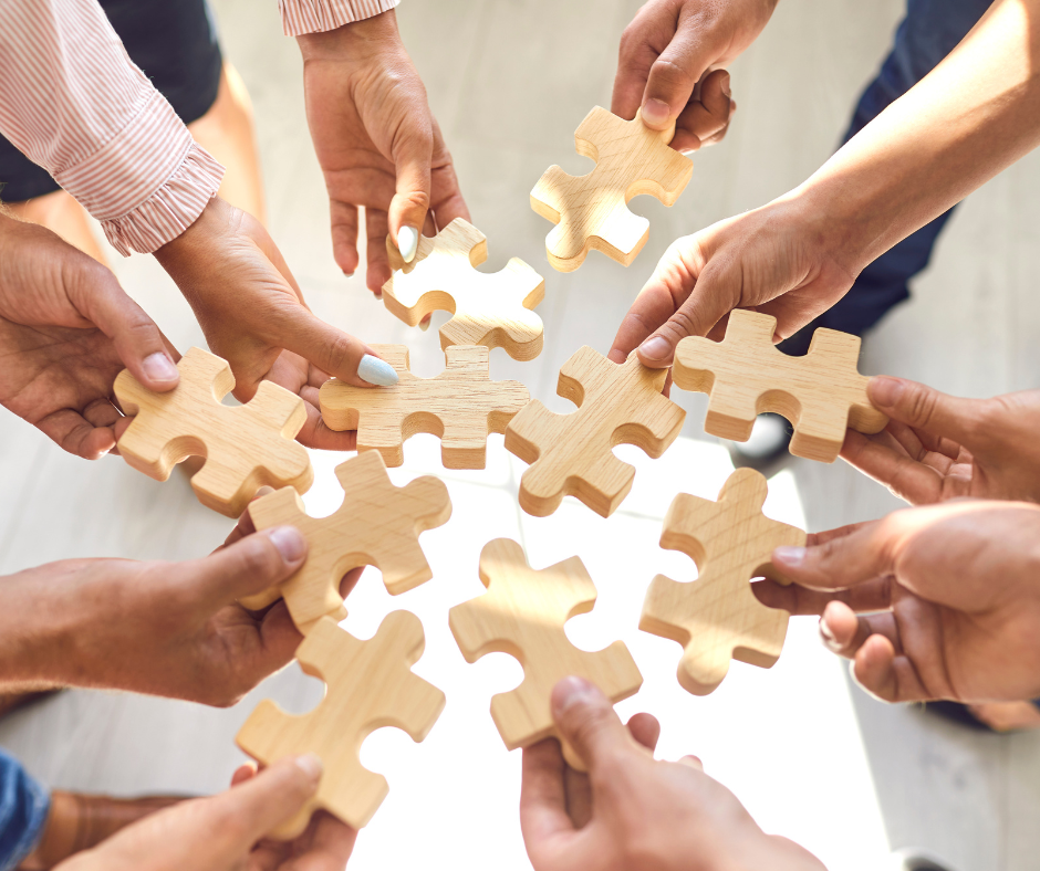 Employee Stock Purchase Plans shown as jigsaw pieces in the hands of employees