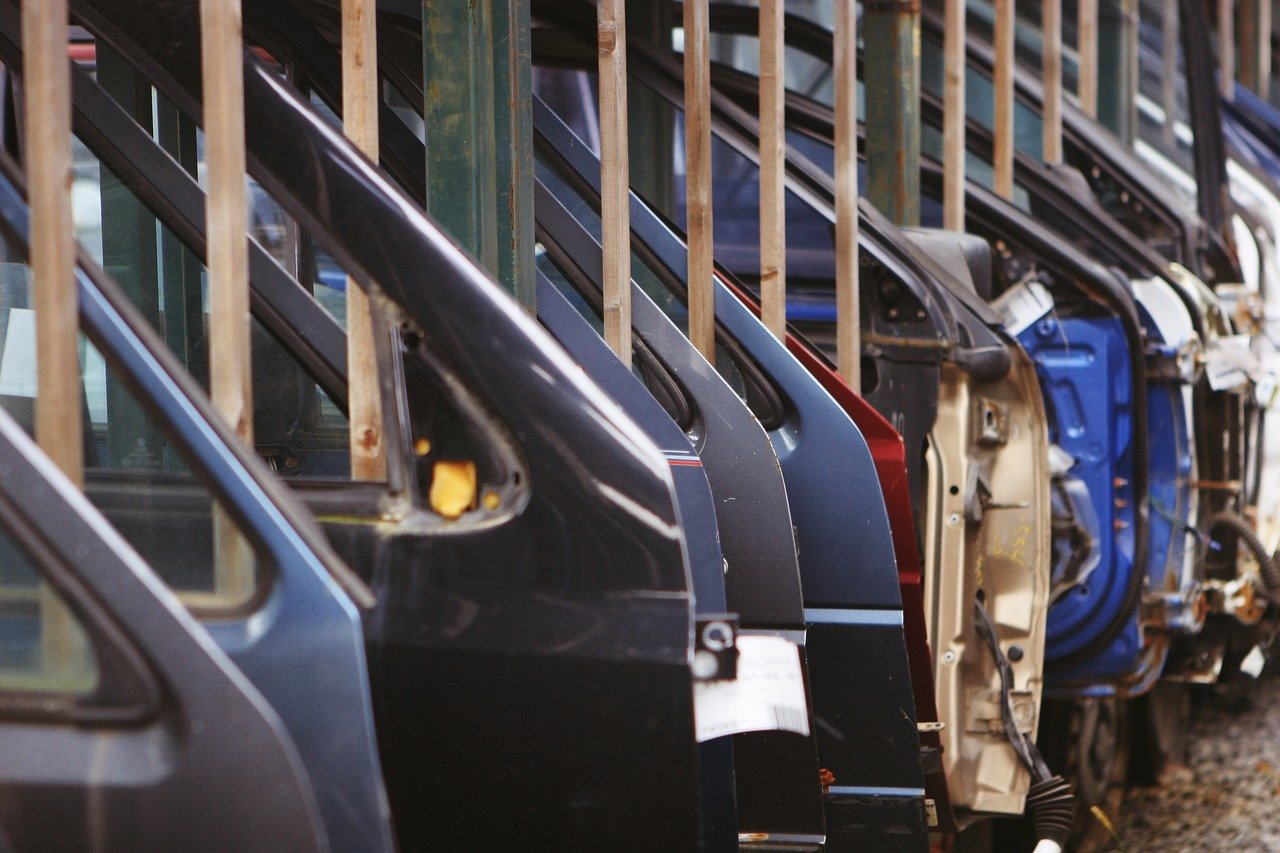 car doors waiting for assembly in a automotive shop