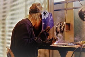 student welding in a vocational school
