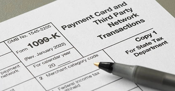 1099k-tax-form 1099k tax form with a pen on top