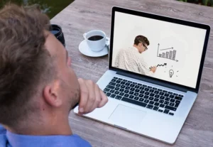 entrepreneur taking an online class on his laptop