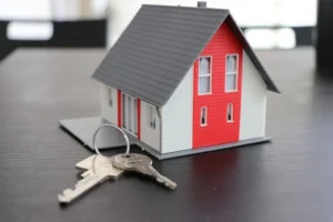 model of a house and keys showing ownership