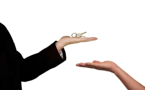 Commercial Landlord handing over key to renter
