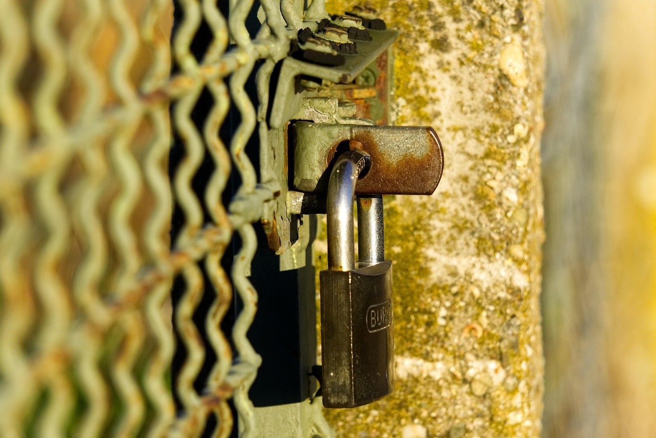 lock on fence representing shutdown lock on fence representing shutdown