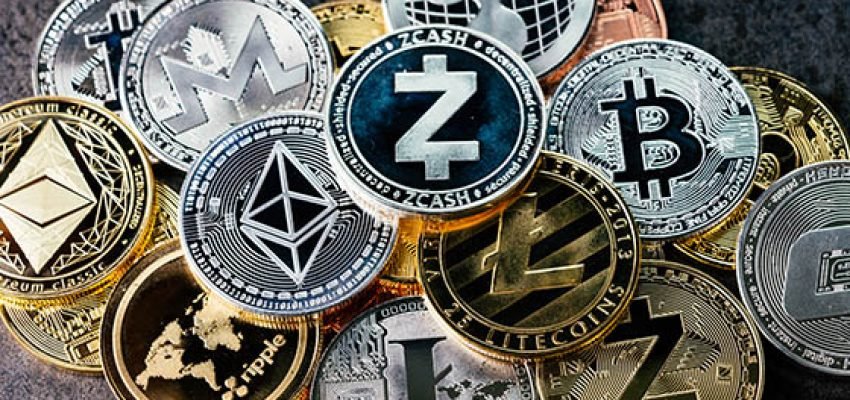 Crypto currency background with various of shiny silver and golden physical cryptocurrencies symbol coins, Bitcoin, Ethereum, Litecoin, zcash, ripple.