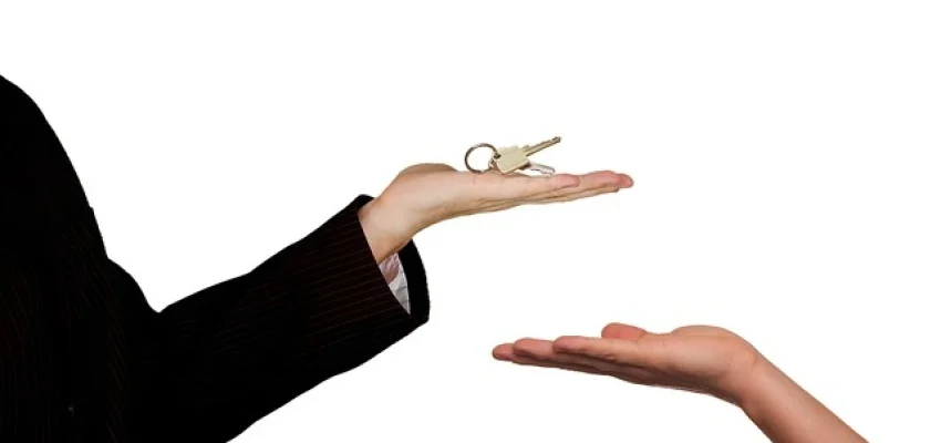Commercial Landlord handing over key to renter