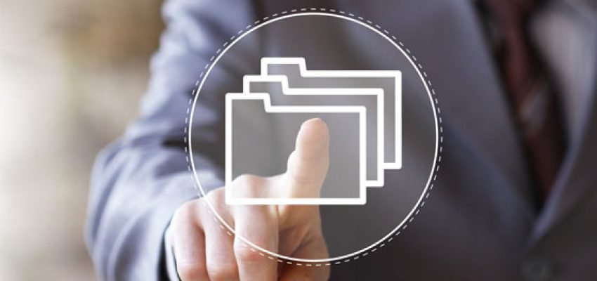 finger pointing at a digital folder representing digital tax files