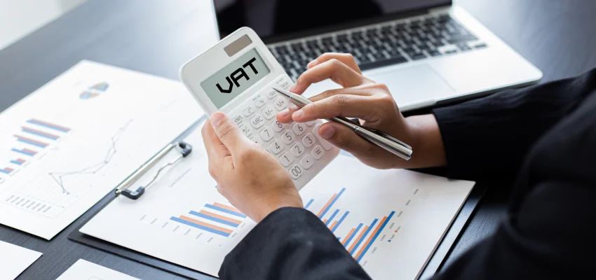 VAT being calculated on a calculator by the tax accountant