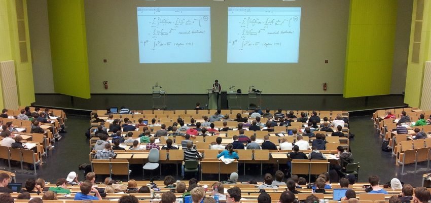 college lecture room with students and teacher