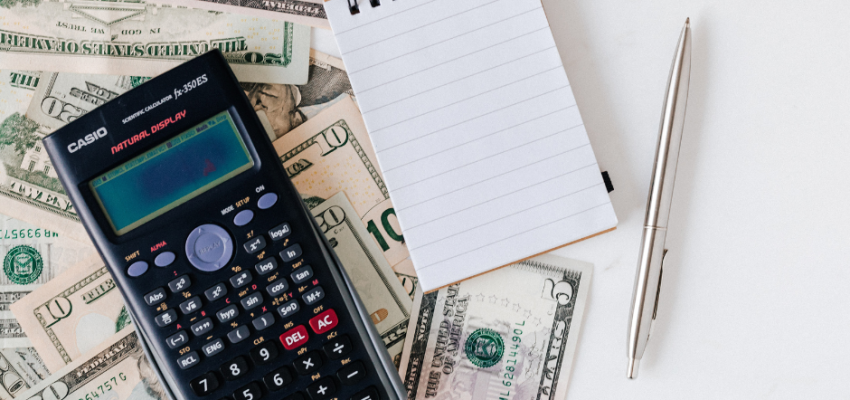 crowdfunding - money, calculator, notepad and pen