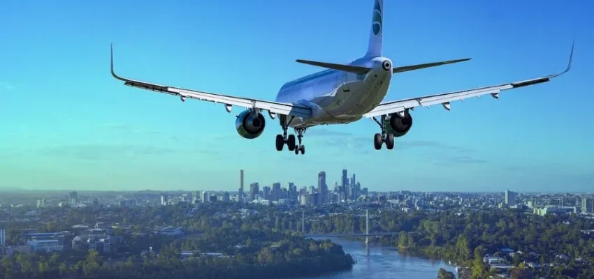aeroplane landing in a city