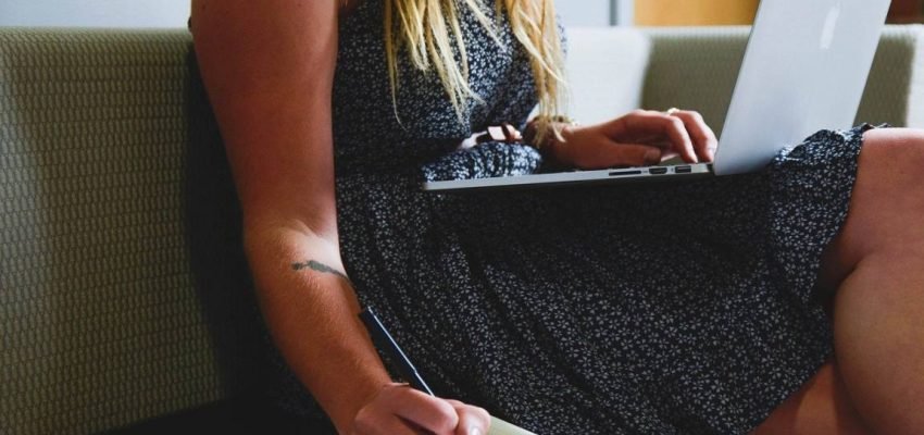 female entrepreneur on her laptop planning and budgeting for her startup