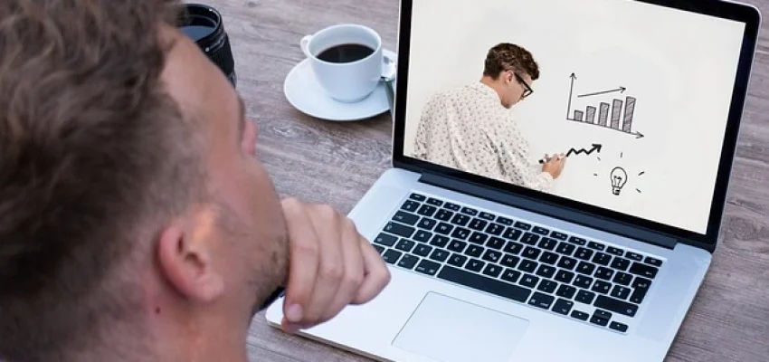 entrepreneur taking an online class on his laptop