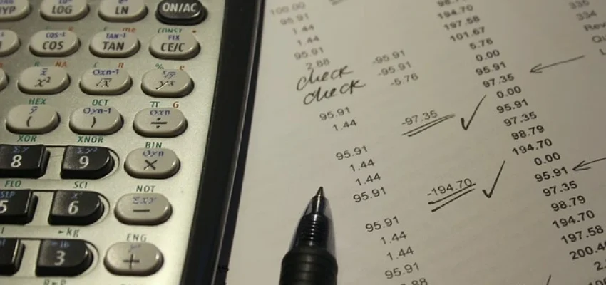 financial statement being rectified by pen and paper instead of a pdf editor
