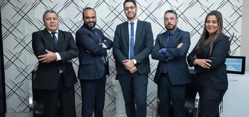 a group of legal professionals posing