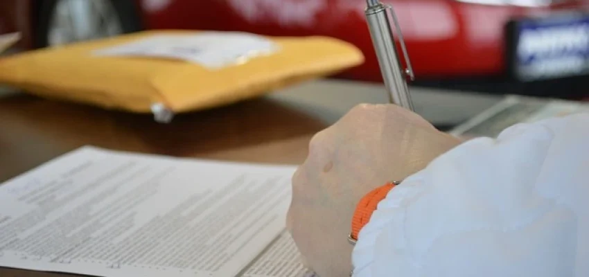 man filling up a legal form