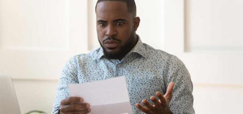 person worried looking at an audit notice