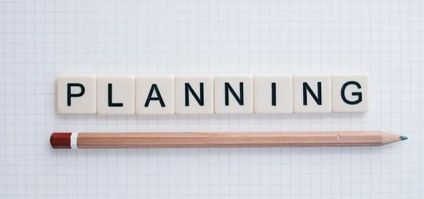 planning spelled out by scrabble tiles