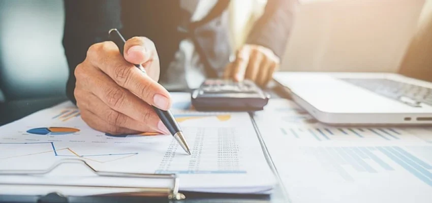 tax professional calculating VAT and sales of a small business