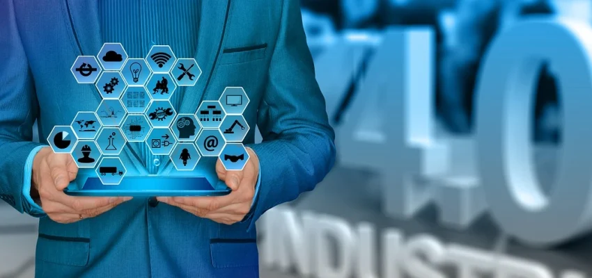 tech startup owner with a tablet seeing different aspects of his business shown as icons