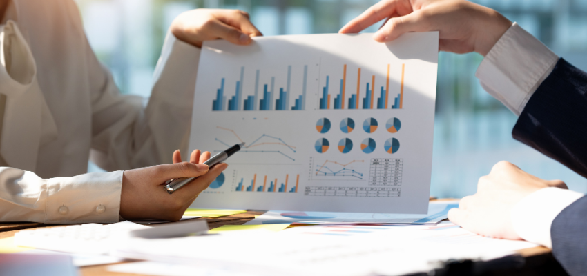 woman showing investment analysis to client